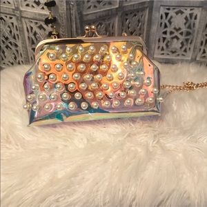 Holographic iridescent pearl clutch with strap